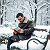 Poetry: In the hush of winters white embrace,  A bench cradles souls in snows soft lace.  Coats of...